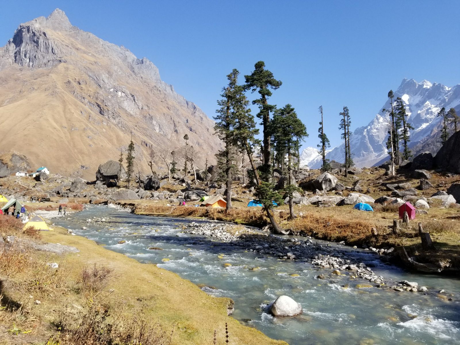 Camping by a glacial stream. Har Ki Doon peak left and Swargarohini Peak right - Himalayan Institute