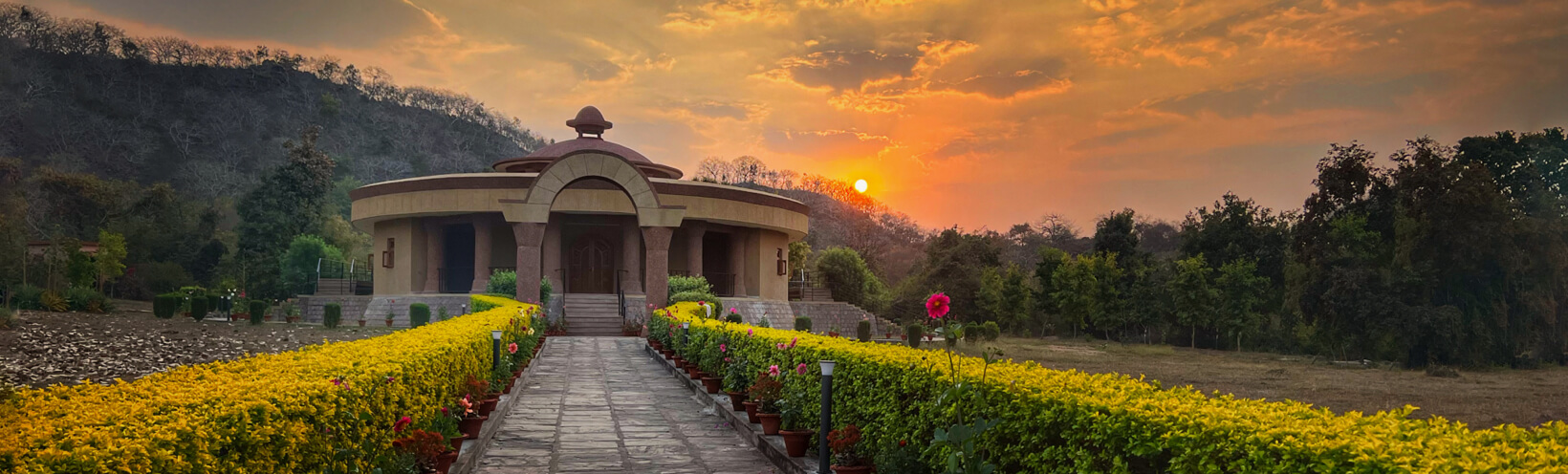 khajuraho shrine sunrise lush banner - Himalayan Institute